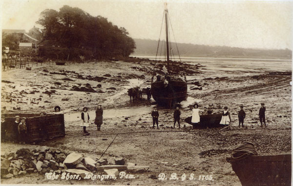 Undated copy of a photograph of the shore Llangwm Pembrokeshire. Limestone is being collected from the boat. The copied photograph has The Shore Llangwm Pem. and D B and S 1705 written at the bottom of the print